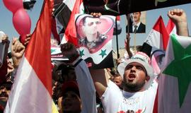 Sirijos TV: žmonės visoje šalyje rengia prezidentą palaikančius mitingus