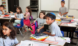 Kuriamas mokyklų tinklas integruoti migrantų vaikams